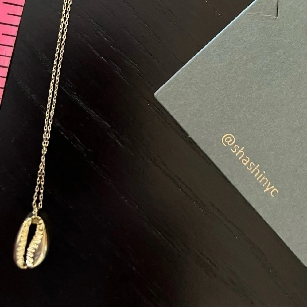 Sashi Gold Tone Shell Necklace